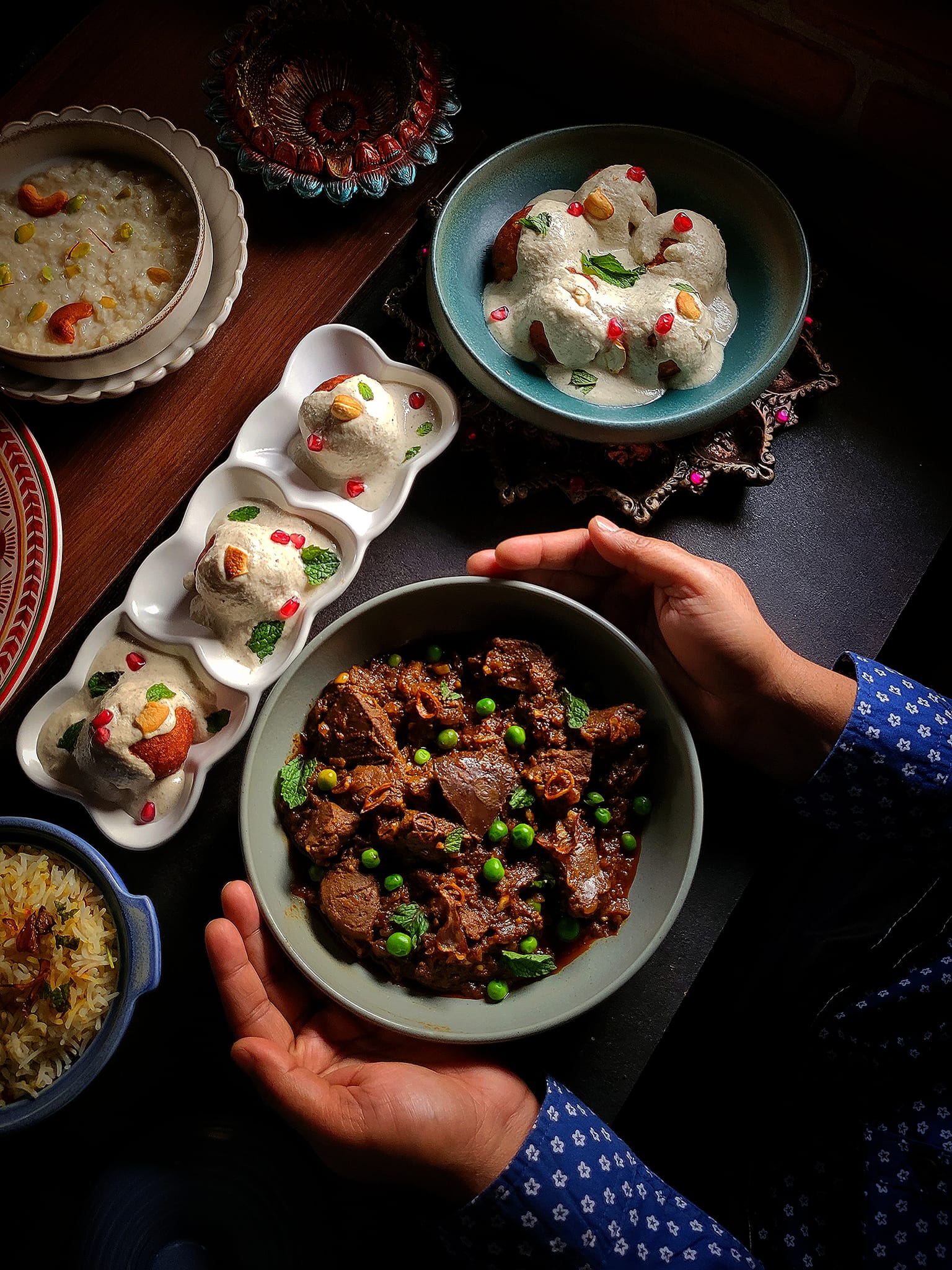 A person holding a bowl with beef stew